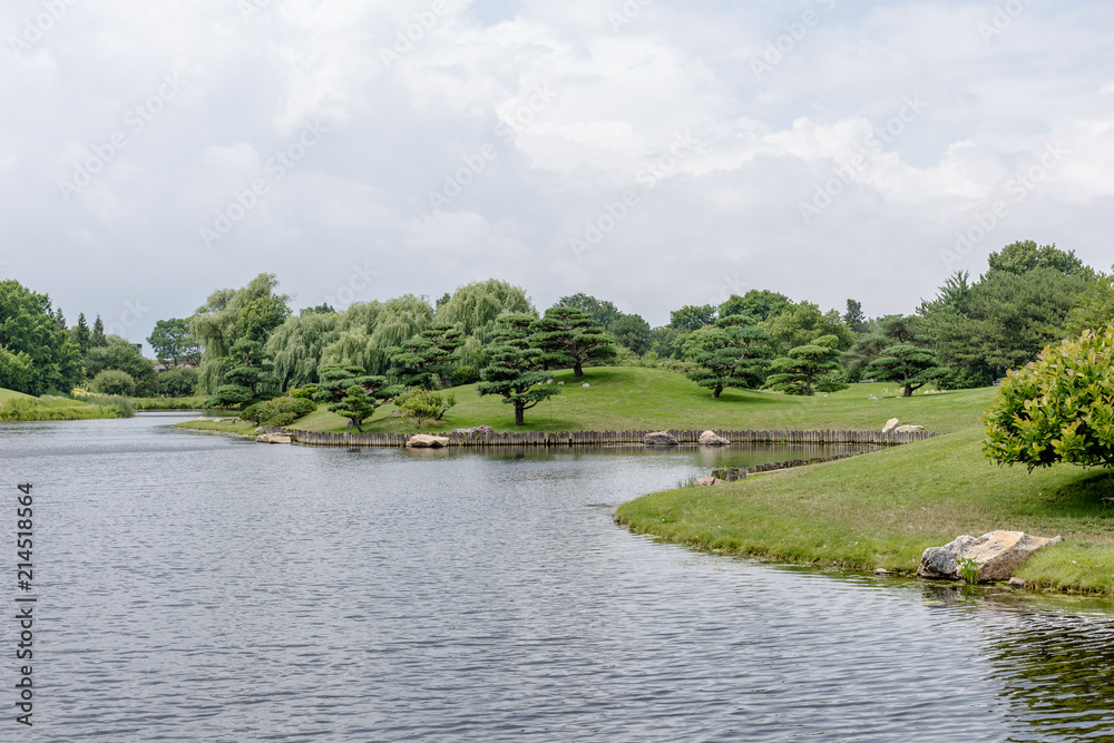 Fototapeta premium Green trees and grass with alcove