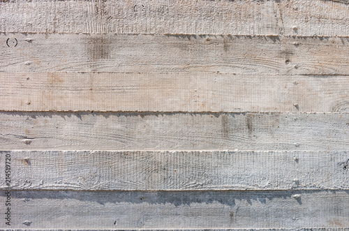 concrete wall with a pattern left by traditional timber formwork