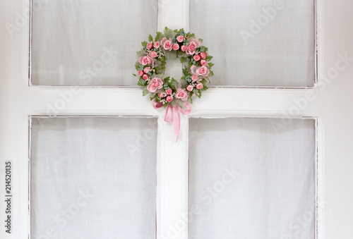 White door  glass window  pink floral welcome wreath ornament