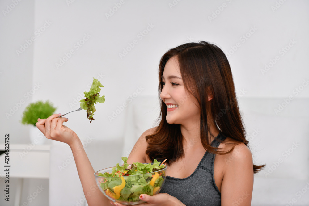 The concept of nutritional food. Beautiful girl takes care of her health by eating vegetables. Young athletes choose a good diet. The concept of nutritional food. Beautiful girl takes care of her health by eating vegetables. Young athletes choose a good diet.