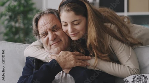 Girl hugging her father with love photo