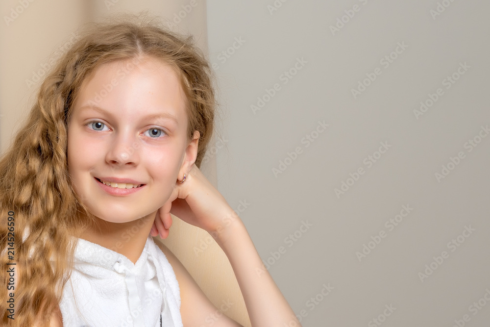 Little girl is sitting on the couch Little girl is sitting on the couch
