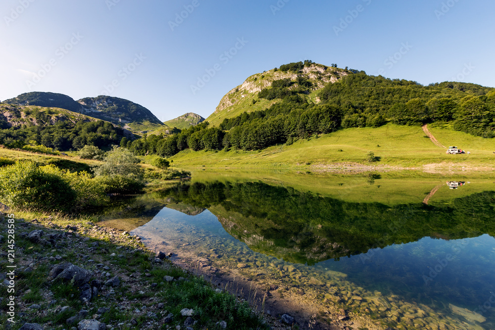 Fototapeta premium Beautiful mountain reflection on lake.Crystal clear reflection of mountains in the lake