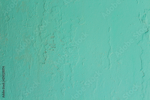 The plaster on the wall is blue. Background. Texture.