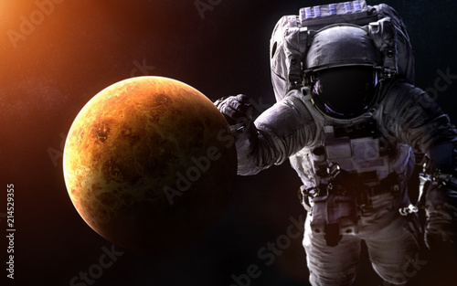 Fototapeta Naklejka Na Ścianę i Meble -  Venus on a blurred background with a giant astronaut. Elements of the image are furnished by NASA