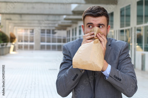 Businessman having a panic attack photo