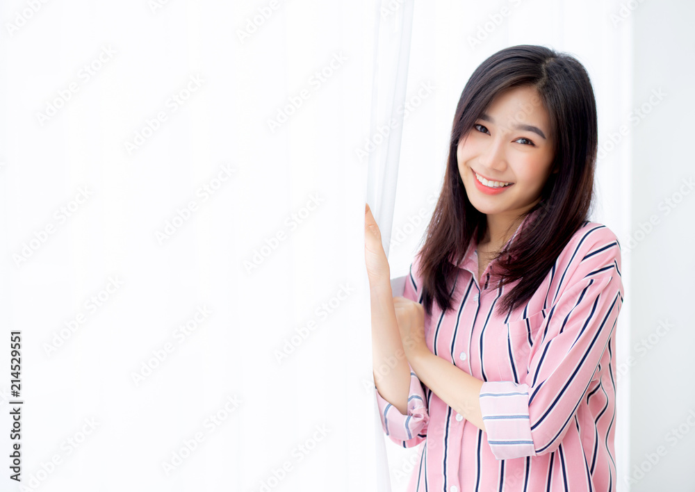 Portrait of beautiful young asian woman standing the window and smile while wake up with sunrise at morning, lifestyle and relax concept. Portrait of beautiful young asian woman standing the window and smile while wake up with sunrise at morning, lifestyle and relax concept.