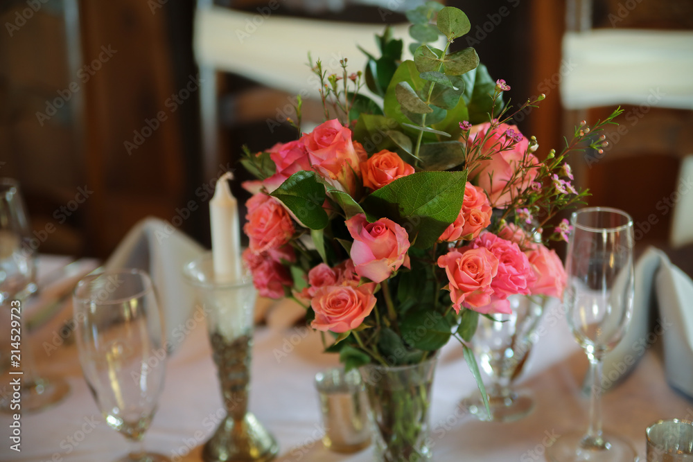 Wedding Reception Table Decorated with Silver and a Pink, White, and Green Centerpiece of Roses Wedding Reception Table Decorated with Silver and a Pink, White, and Green Centerpiece of Roses