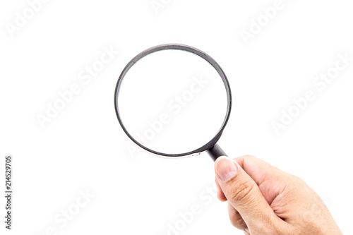 Hand holding magnifying glass on white background.