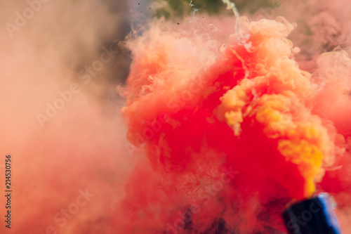 colorful red smoke bombs in action photo