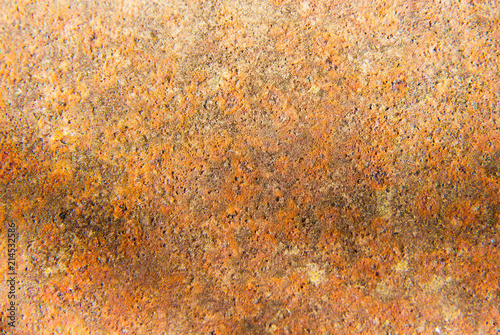 Red and brown rusty metal texture on porous surface. Texture of rust, copper patina corrosion.
