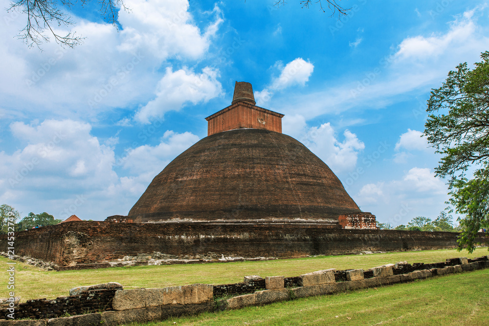 Explore the ancient world of Sri Lanka with this stunning stock photo of Jetavanaramaya dagoba in the sacred city of Anuradhapura. A must-see for history enthusiasts and wanderlust travelers alike
