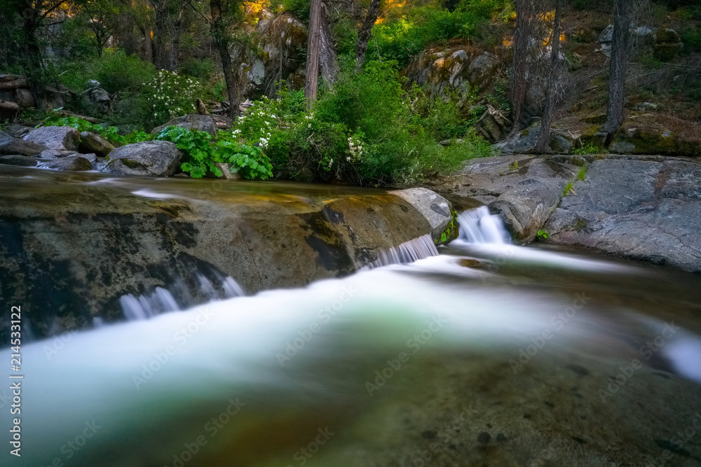 Solid Rock Creekbed With Smooth Flowing Water Falls Spilling Over It Solid Rock Creekbed With Smooth Flowing Water Falls Spilling Over It