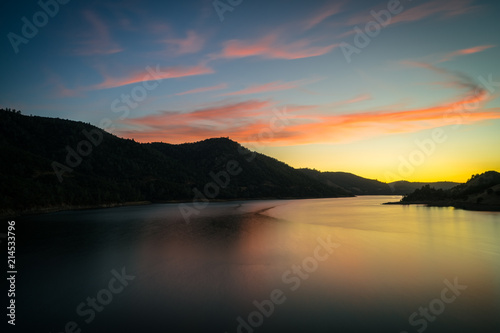 Smooth Water of Don Pedro Reservoir, With Pink Sunset Clouds