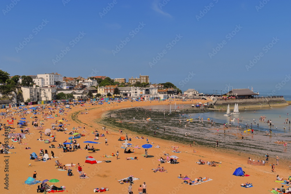 Viking bay beach packed with tourists and locals enjoying the sunshine. Broadstairs, Kent, England Viking bay beach packed with tourists and locals enjoying the sunshine. Broadstairs, Kent, England