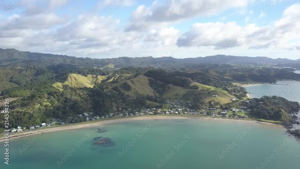 Beach Village with rolling hill - New Zealand Beach Village with rolling hill - New Zealand