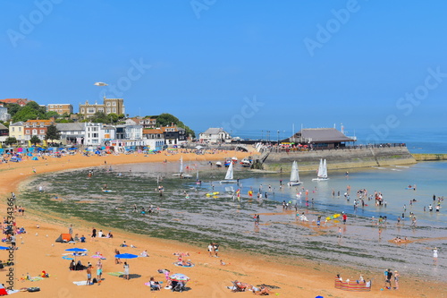 People enjoy the beach in Broadstairs, Kent as the hot weather in England continues. Beach goers swimming, sailing and sunbathing in the horseshoe Viking Bay in Kent county. England