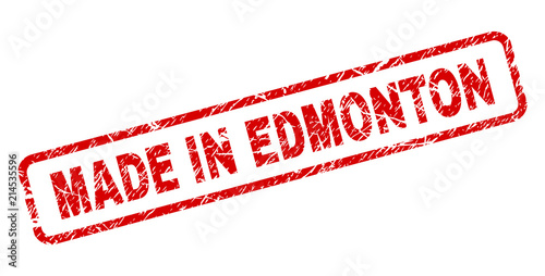 MADE IN EDMONTON stamp seal imprint with grunge style. Red vector rubber print of MADE IN EDMONTON text with unclean texture. Text caption is placed inside rounded rectangle frame.