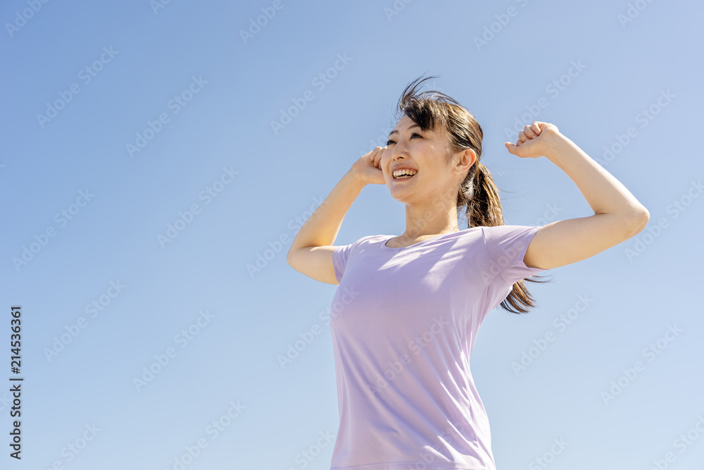 portrait of sporty asian woman blue sky portrait of sporty asian woman blue sky