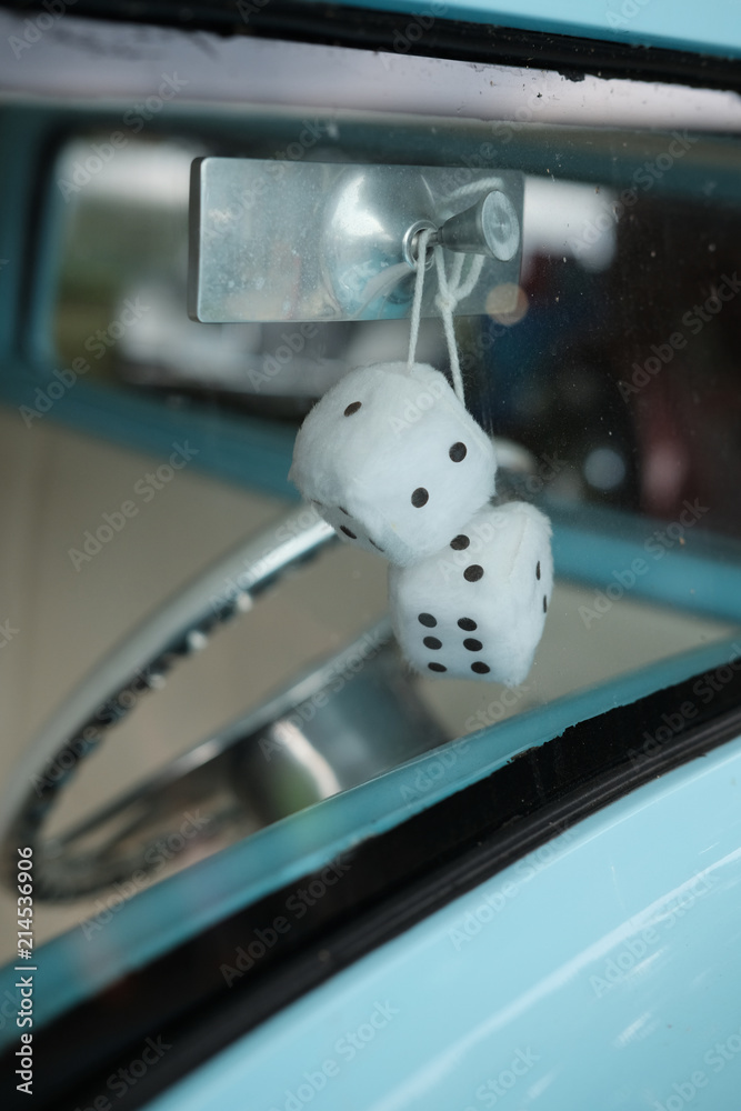 Pair of Fuzzy Dice Hanging in Rearview Mirror · Free Stock Photo
