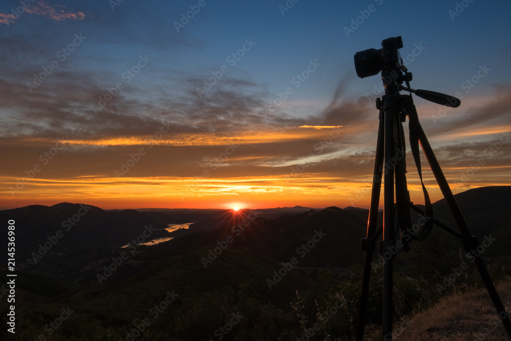 Mirrorless Camera on Tripod With A Beautiful Sierra Sunset and Sunstar