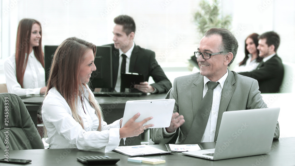 employees using digital tablet to work with financial data employees using digital tablet to work with financial data