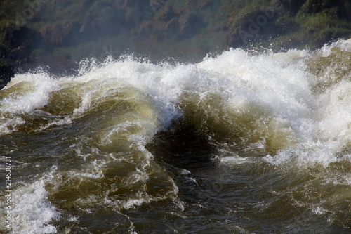turbulent waters close-up with green background
