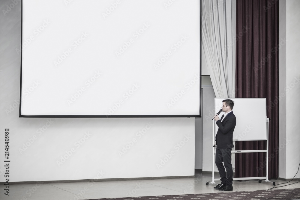 speaker conducts the business of the conference in the modern conference room speaker conducts the business of the conference in the modern conference room