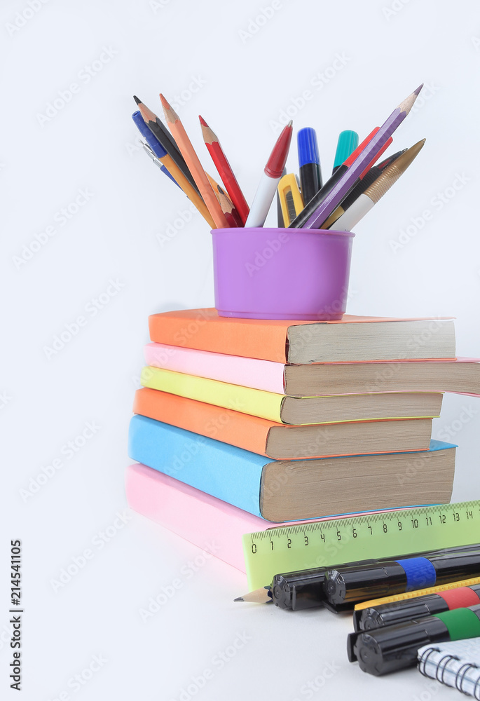 books and a variety of office supplies on white background .phot books and a variety of office supplies on white background .phot
