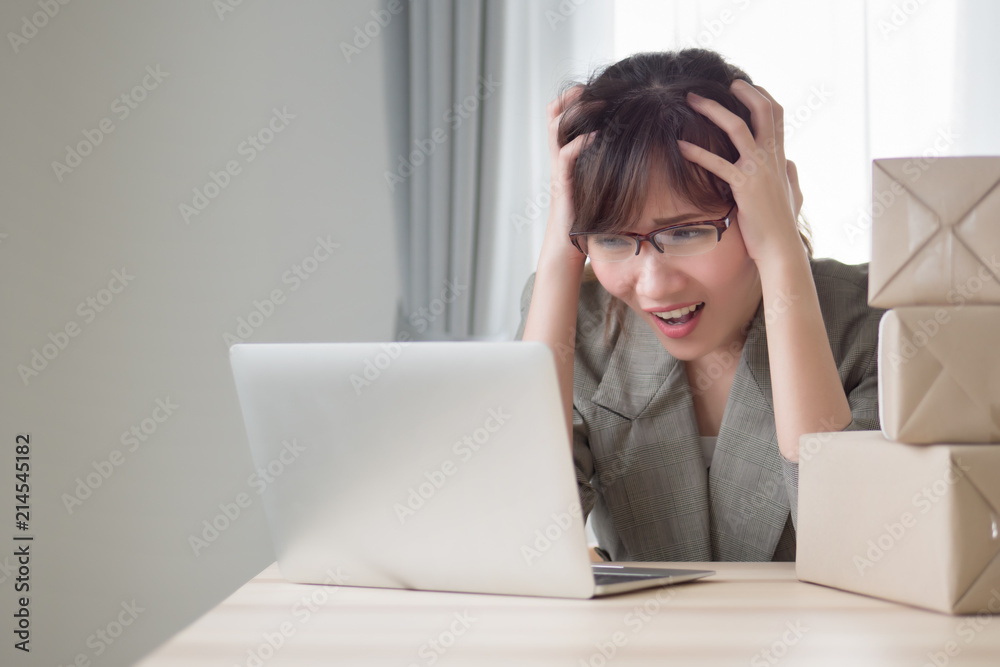 asian woman business owner working with stress and headache; portrait of sad stress unhappy business woman getting headache from business failure, loss, problem; adult asian chinese woman model asian woman business owner working with stress and headache; portrait of sad stress unhappy business woman getting headache from business failure, loss, problem; adult asian chinese woman model