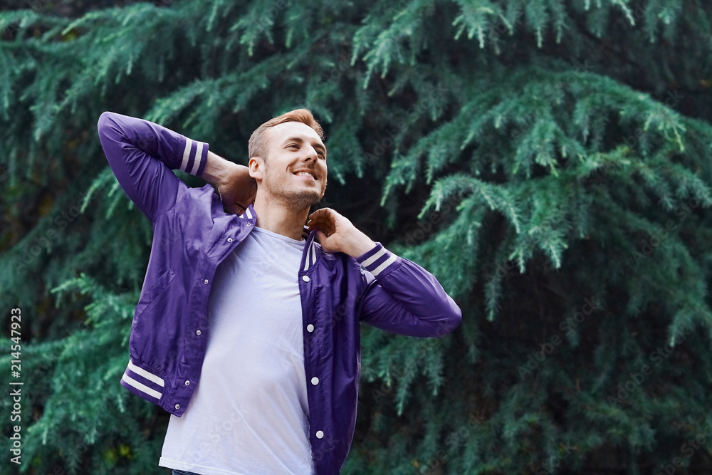 Man in the forest against green tree background Man in the forest against green tree background
