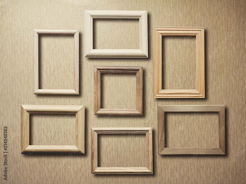 Fototapeta premium old frames on wooden wall
