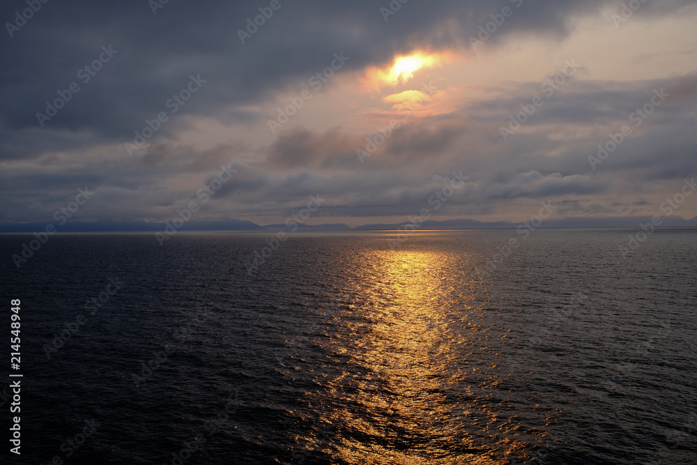 Early morning sun over the still waters of Alaska Early morning sun over the still waters of Alaska