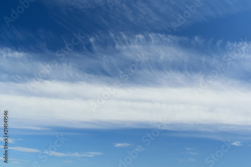Spindrift clouds in deep blue sky