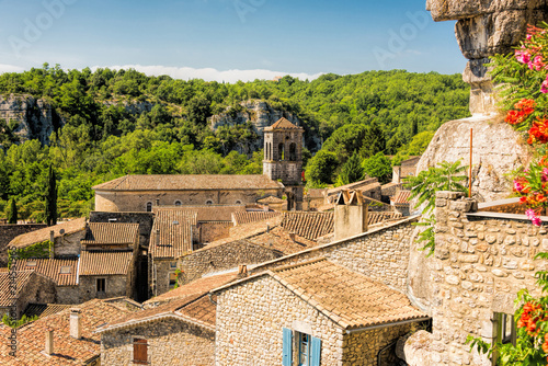 Fantastic view of the tower of Saint Pierre church and the old houses in the French community Labeaume at the Ardeche