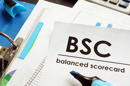 Documents about balanced scorecard BSC on a table. photo