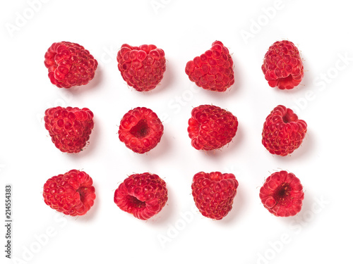 View from above of ripe red raspberry on white background. Organic raspberries creative layout pattern, isolated on white with clipping path. Top view or flat lay. Vegan food concept
