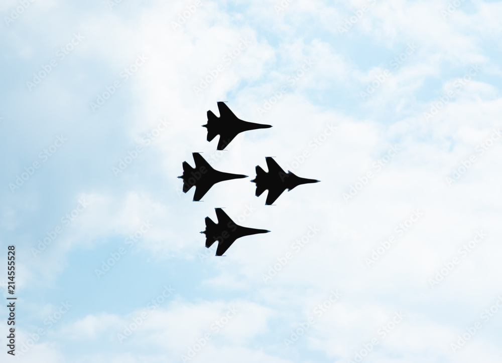 black silhouettes of aircraft against the sky black silhouettes of aircraft against the sky