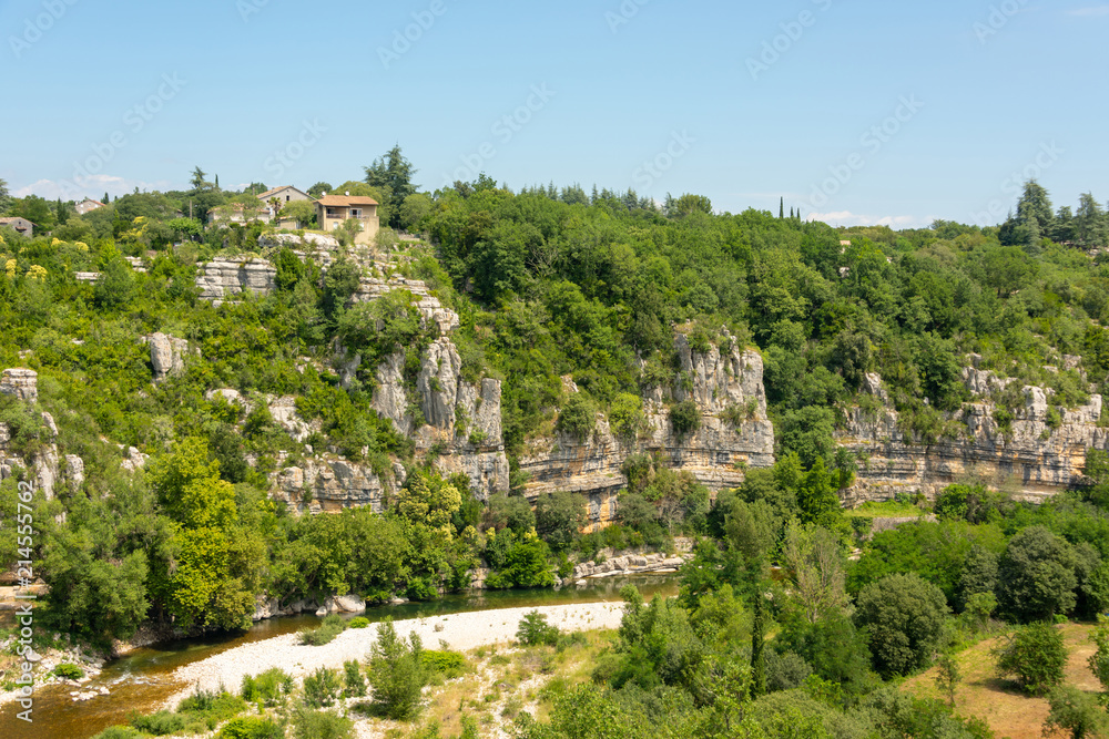 Panoramic view of the rocky canyon with its river Ardeche near the old village Labeaume in France