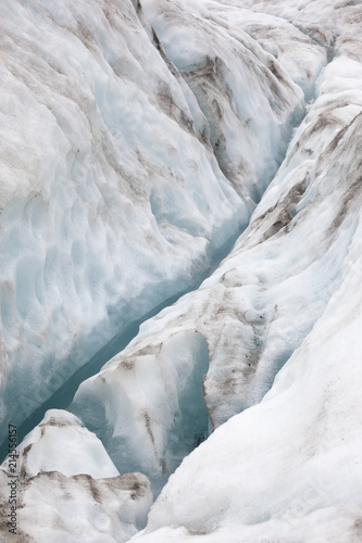 Glacier with watery crevice at Franz Josef Galcier, New Zealand.