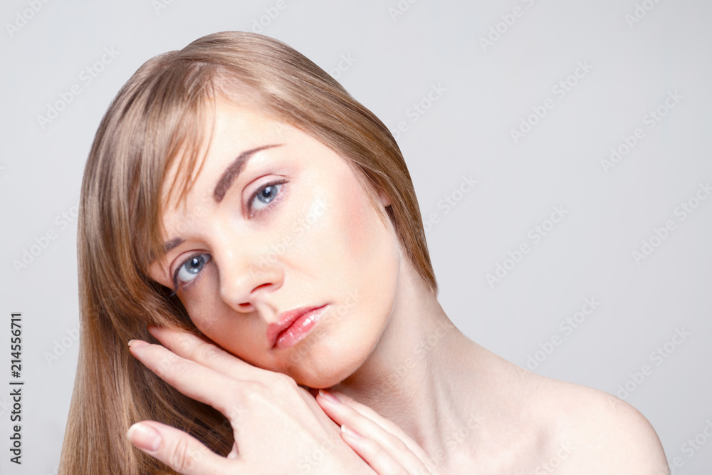 Beautiful caucasian woman with make-up poses in studio, close up portrait Beautiful caucasian woman with make-up poses in studio, close up portrait