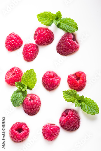 Raspberries and mint on yogurt background