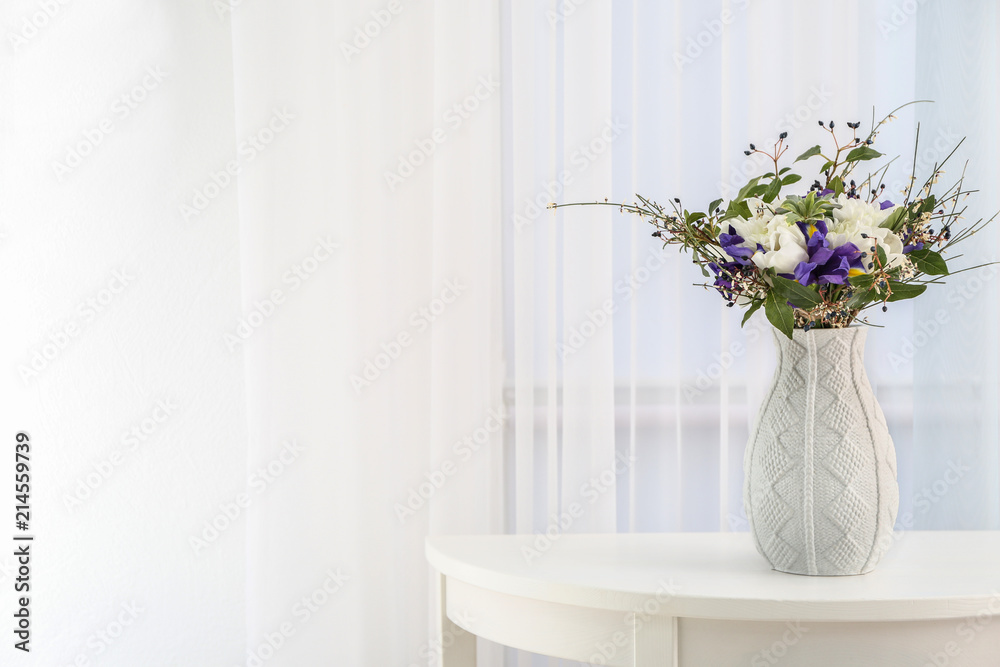 Vase with beautiful bouquet of different flowers as gift on table