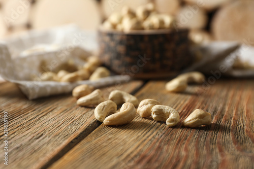 Fototapeta Naklejka Na Ścianę i Meble -  Tasty cashew nuts on wooden table