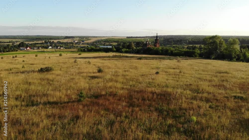 Flight in the countryside over the church in the summer. Aerial photography. 4K Flight in the countryside over the church in the summer. Aerial photography. 4K