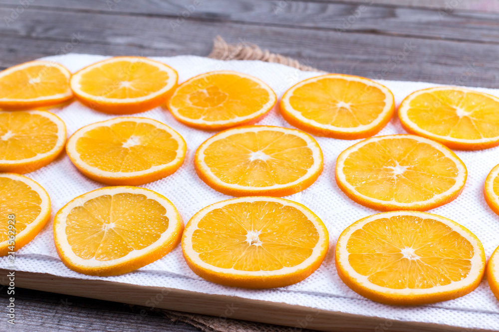 Dried oranges. Process of preparation of orange candied fruits for for New Year and Christmas party Dried oranges. Process of preparation of orange candied fruits for for New Year and Christmas party