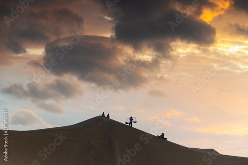 Vietnamese women carry traditional basket on their shoulder in the desert of  Ninh Thuan  Vietnam