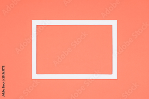 Abstract flat lay pastel orange colored paper texture minimalism background. Minimal template with empty picture frame mock up.