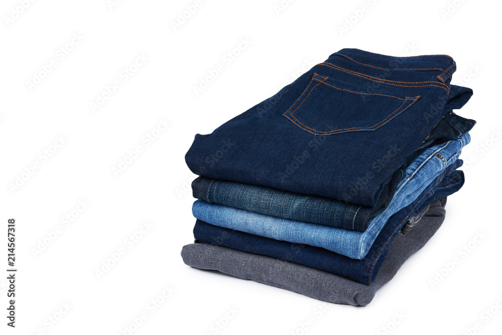 Foldet jeans in pile, isolated on white background. copy space template Foldet jeans in pile, isolated on white background. copy space template