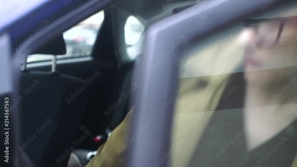 Business lady, blonde gets into the car.
Business lady, blonde gets into the car.